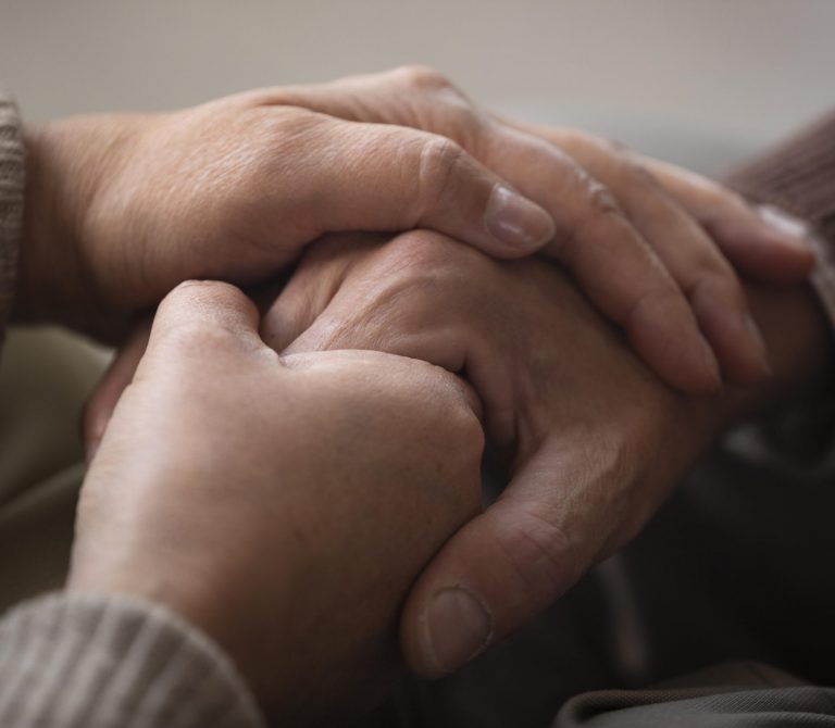 close-up-senior-couple-holding-hands