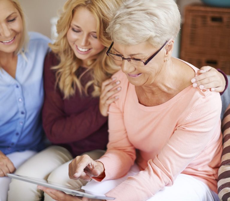 girl-with-mom-supporting-grandma-which-learning-use-digital-tablet