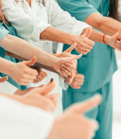 team-medical-professionals-showing-thumbs-up